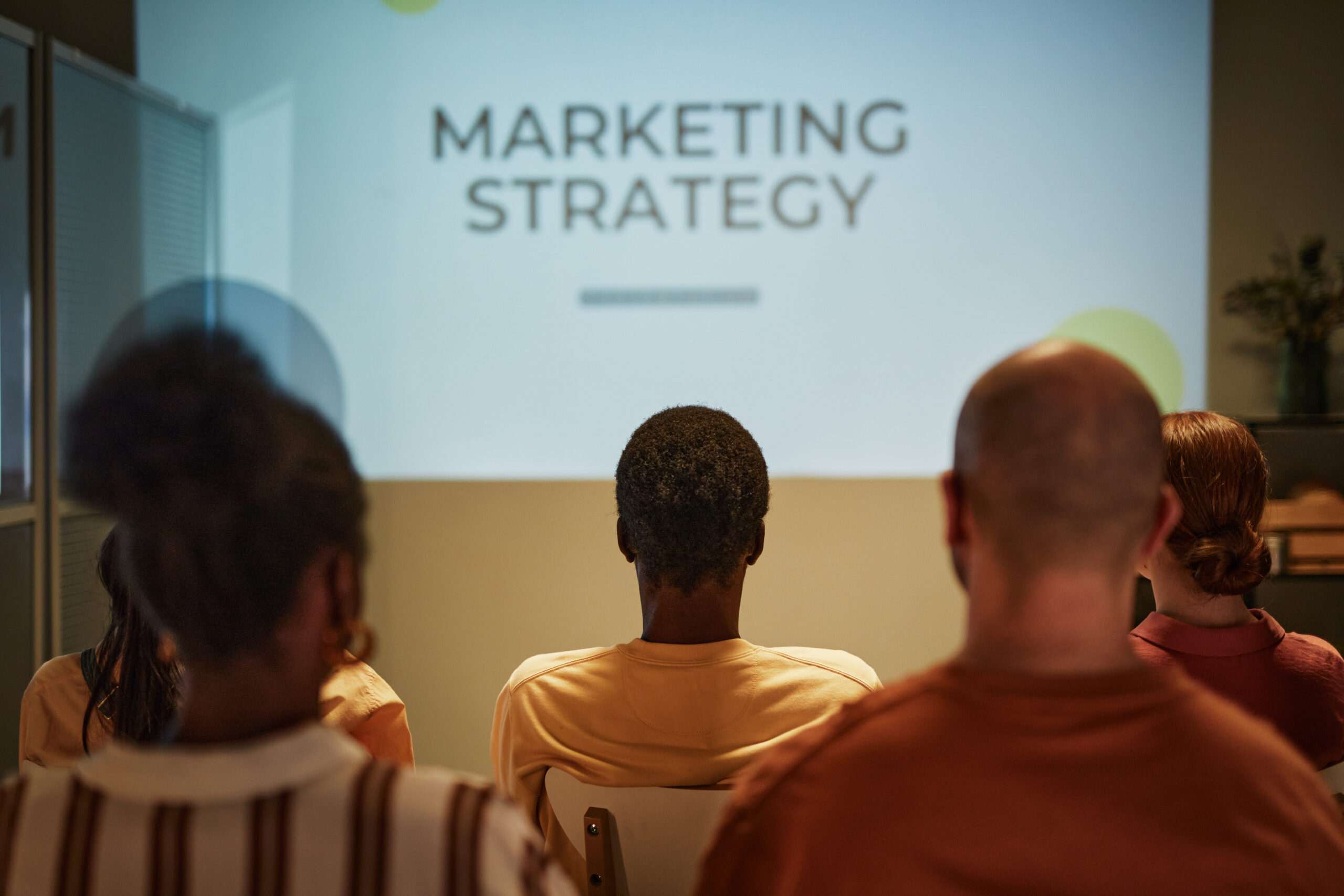 People watching a presentation about a market expansion strategy