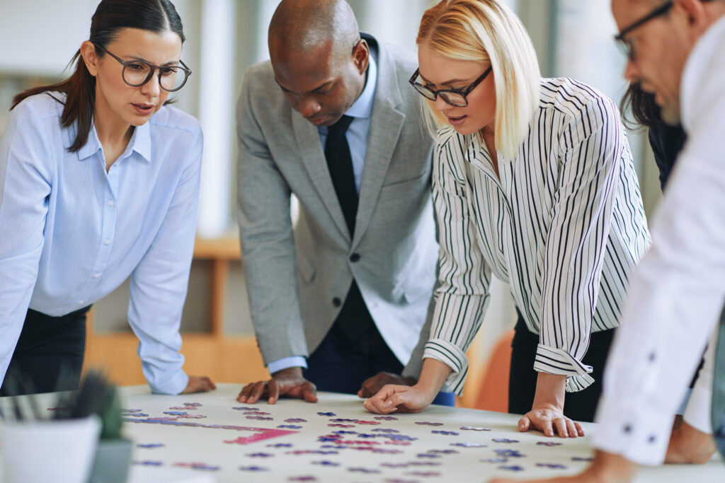 A business team trying to find ways to build brand awareness